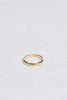 close up of men's moderately textured gold band