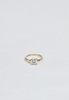 four prong gold ring with round white diamond