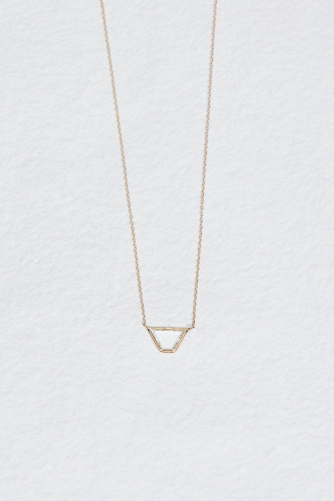 gold necklace with trapezoid shaped diamond slice