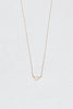 gold necklace with gold triangle