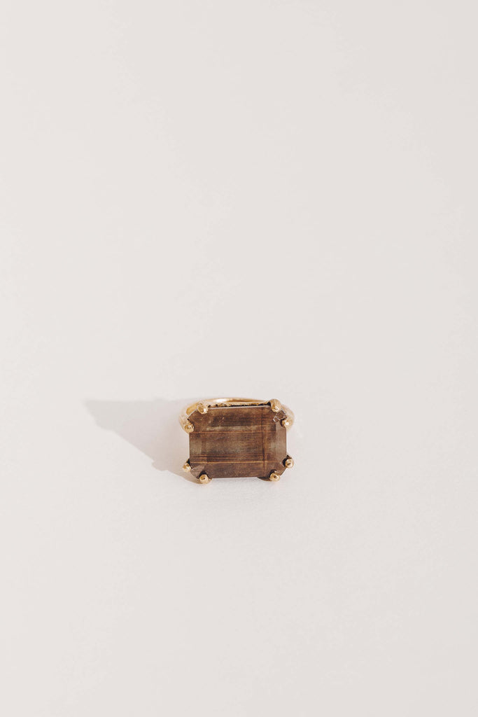 gold 8 prong ring with emerald cut chocolate sapphire