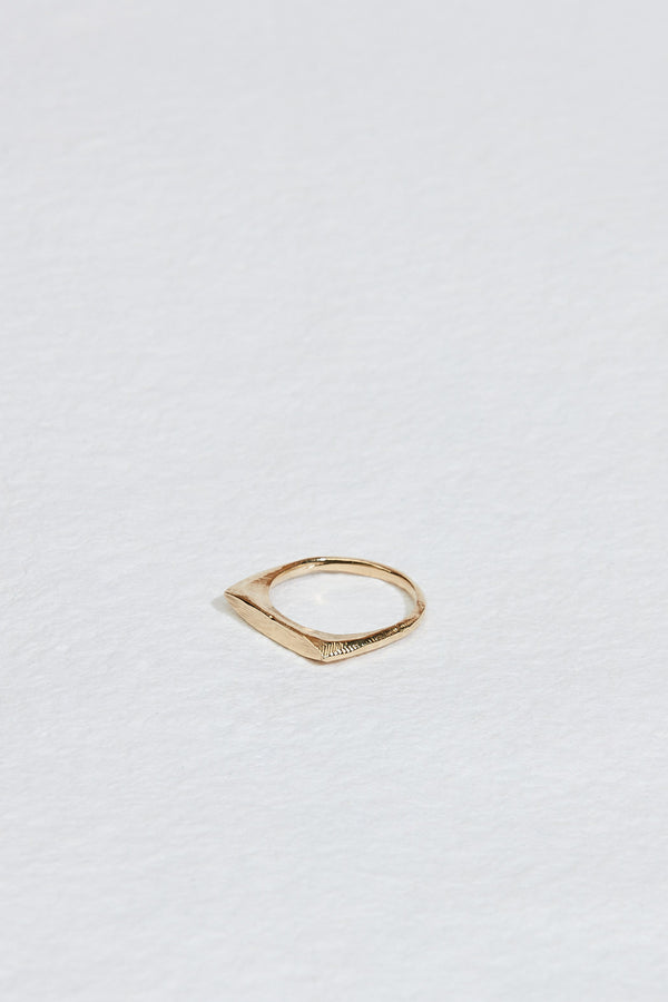 side view of gold ring with angular face