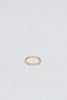 yellow gold band with three baguette white diamonds