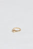 side view of gold ring with cushion cut bezel set white diamond