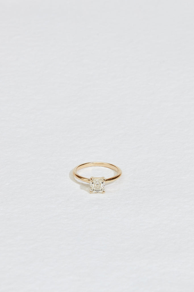 four prong gold ring with asscher cut white diamond