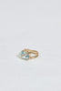 side view of gold split textured band with oval aquamarine