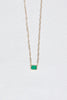 gold cable chain necklace with bezel set emerald cut emerald