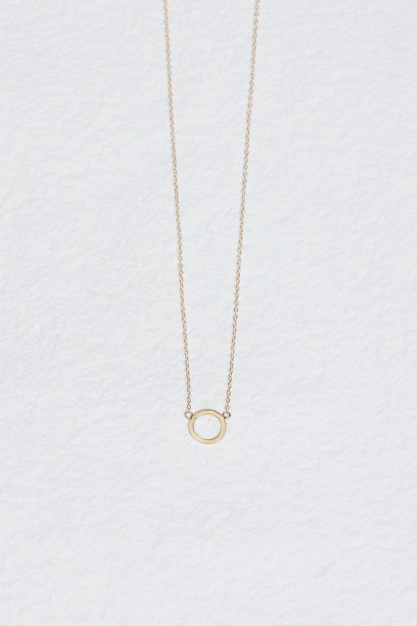 gold necklace with gold circle