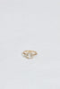 gold ring with elongated rose cut oval diamond and round white diamonds