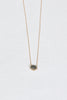 gold necklace with oval speckled sapphire