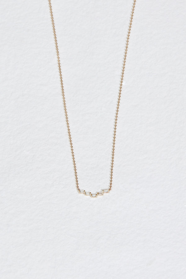 gold ball chain necklace with five baguette cut stair step diamonds
