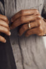 close up of man's hand wearing gold band