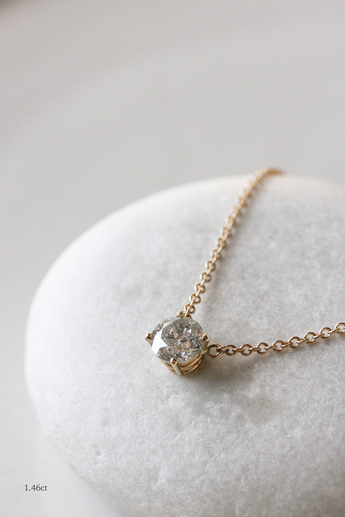 close up of 1.46ct gold necklace with round salt and pepper diamond