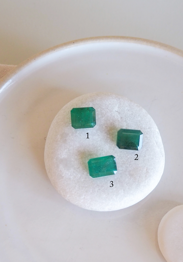 three emerald cut emeralds