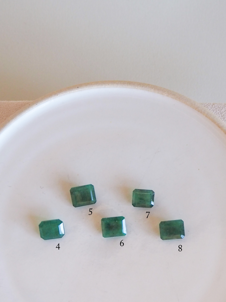 five emerald cut emeralds
