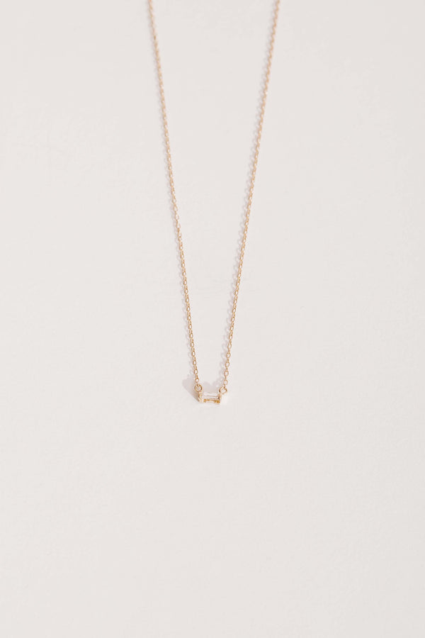 gold necklace with white diamond baguette