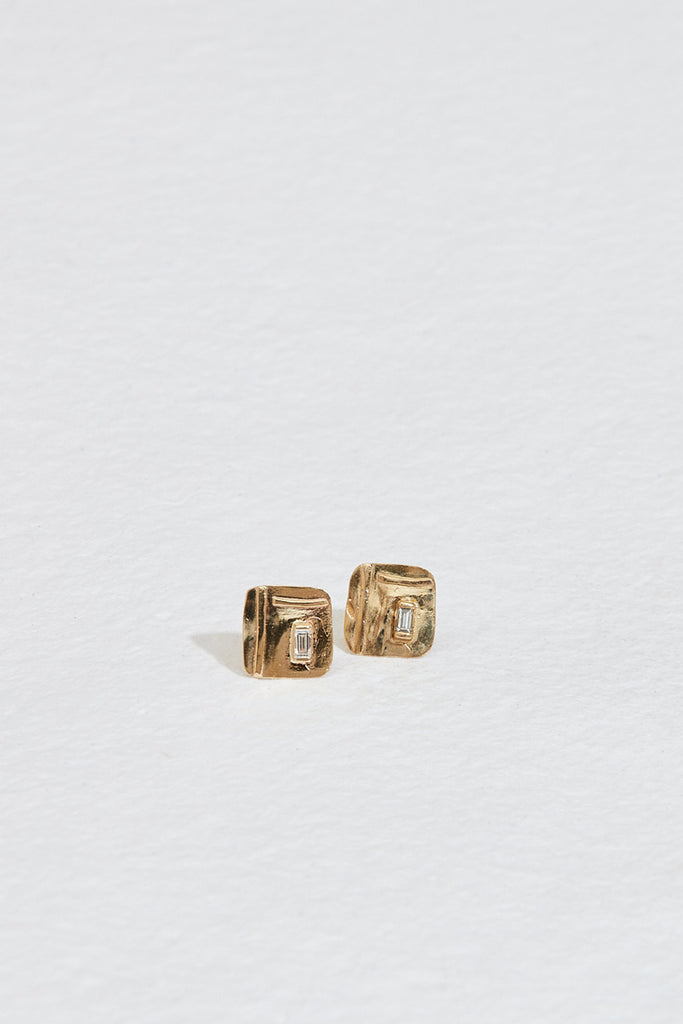 free form gold square studs with baguette white diamond
