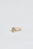 side view of gold ring with decagon bezel set round brilliant diamond