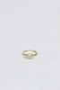 gold ring with bezel set emerald cut white diamond