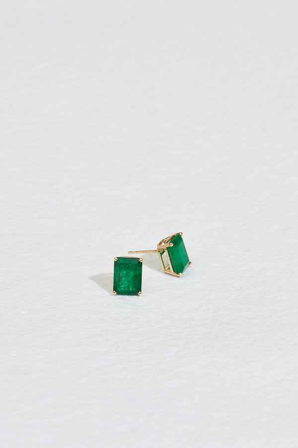 gold emerald cut emerald studs with side view