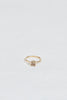 gold four prong ring with cushion cut light champagne diamond