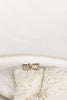 gold studs with three baguette white diamonds