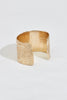 back view of thick gold cuff bracelet with texture