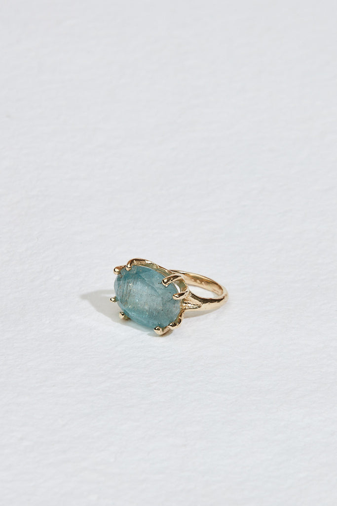 side view of gold textured 8 prong ring with moss aquamarine
