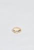 gold knife edge band with two bullet cut white side diamonds and center round-cornered rectangular white ocean diamond