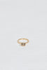 gold ring with bezel set oval champagne diamond