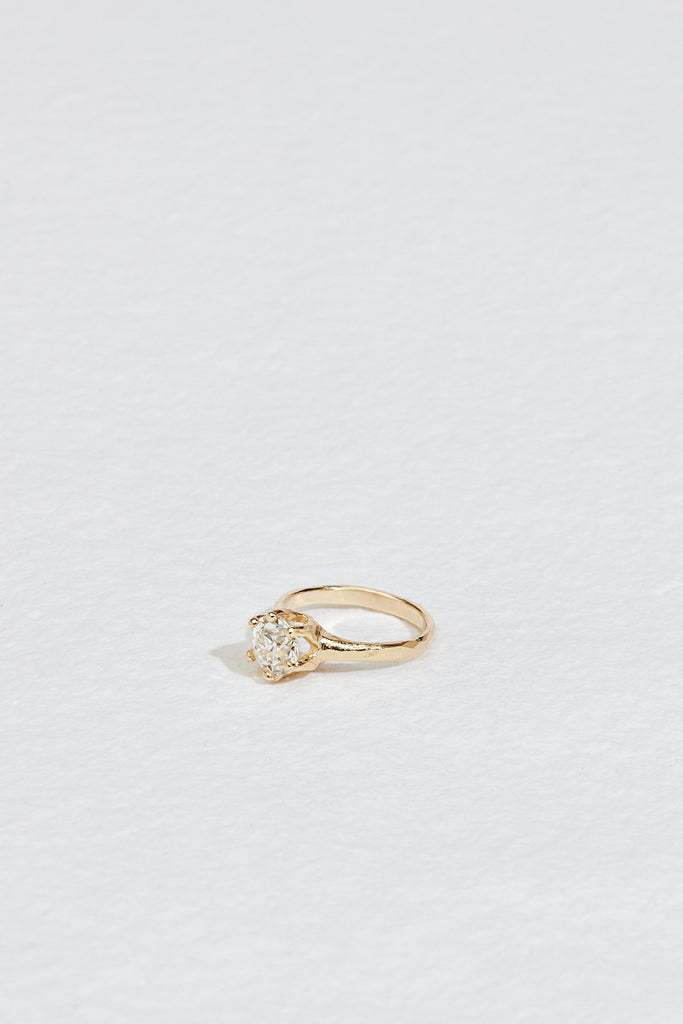 side view of gold six prong ring with old euro cut round diamond
