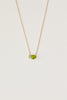 gold necklace with oval peridot